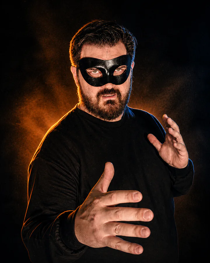 Glenn C. Hahn wearing a black mask as The Villain